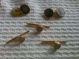 Gold and cuff links and shirt studs