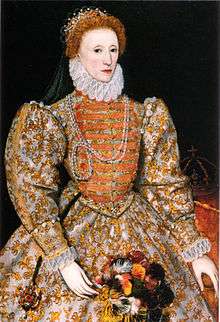 Woman, facing left, with a tiara on red-coloured hair, wearing voluminous and heavily decorated clothing with large sleeves, tight waist and a ruff round the neck. A crown on a table is visible in the background