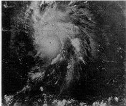 Satellite image of a mature hurricane. The storm features a small, but prominent eye and the whole system covers most of the eastern Caribbean Sea. Haiti can be seen along the edge of a feeder band and eastern Cuba is also visible on the left side of the image.