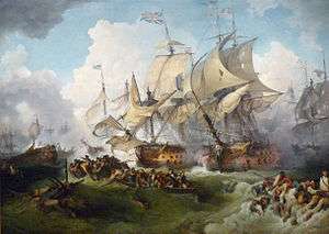 Two large ships sail side by side locked in battle as heavy brown seas roll beneath them and clouds of smoke from other vessels in the background drift into frame. In the foregound, dozens of men cling to wreckage in the water or drift in small boats.