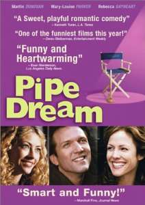 "Pipe Dream" is written in yellow next to a movie set folding chair. Below are three photos, side by side, of smiling thirty-somethings&nbsp;: a blonde woman, a man and a dark-haired woman.