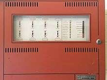 A Fire-Lite Sensiscan 1000 fire alarm control panel in a building at Oklahoma State University.