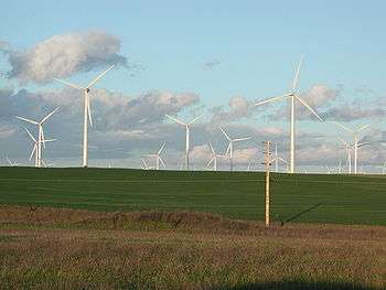Some of the 1.5 MW Phase I turbines stand 80 metres (260&nbsp;ft) tall. The surrounding land is used for sheep grazing and growing hay.